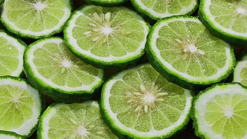 Fresh sliced ​​Kaffir lime on the background