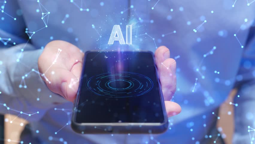 Hand holding smartphone horizontally. Mobile device displaying futuristic holographic AI interface above screen. Glowing digital elements floating. High-tech atmosphere with cybernetic connections. - Powered by Shutterstock - Get 15% off with code: PIKWIZARD15