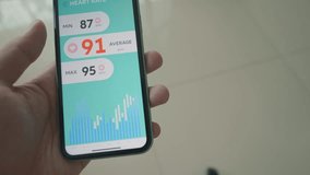 A close-up of a hand holding a smartphone displaying a health notification app. The interface shows information about vaccinations and health updates, promoting wellness in a digital age. - Powered by Shutterstock - Get 15% off with code: PIKWIZARD15