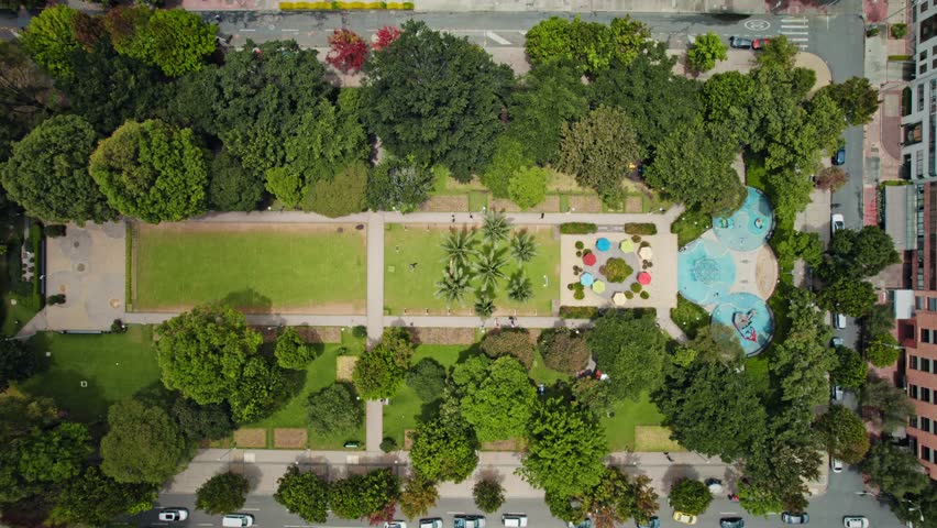 Aerial Top View of City Park with Playground and Trees - Parque de la 93, Bogotá, Colombia