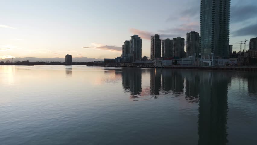 Sunset Over the Fraser River and New Westminster City Skyline in British Columbia