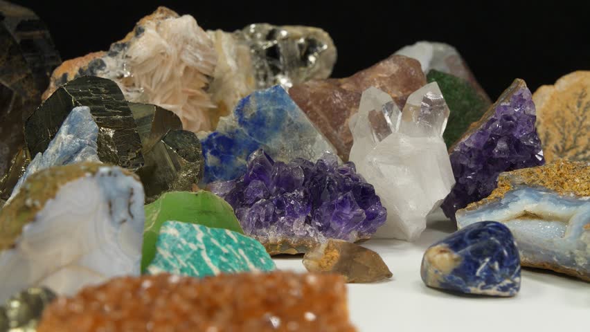 Semi Precious stones and minerals, riches of the Earth. Purple Amethyst, golden Pyrite, green Nephrite, blue Lazurite, yellow Citrine, Agate, Uvarovite or green garnet, Amazon stone, Quartz crystals