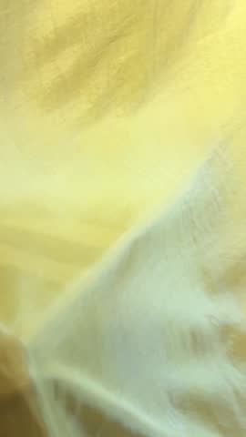 silk production starting from the cocoon of caterpillar larvae on mulberry leaves ending with machines and finished products. machines wooden machines stretch silk threads no people fabrics