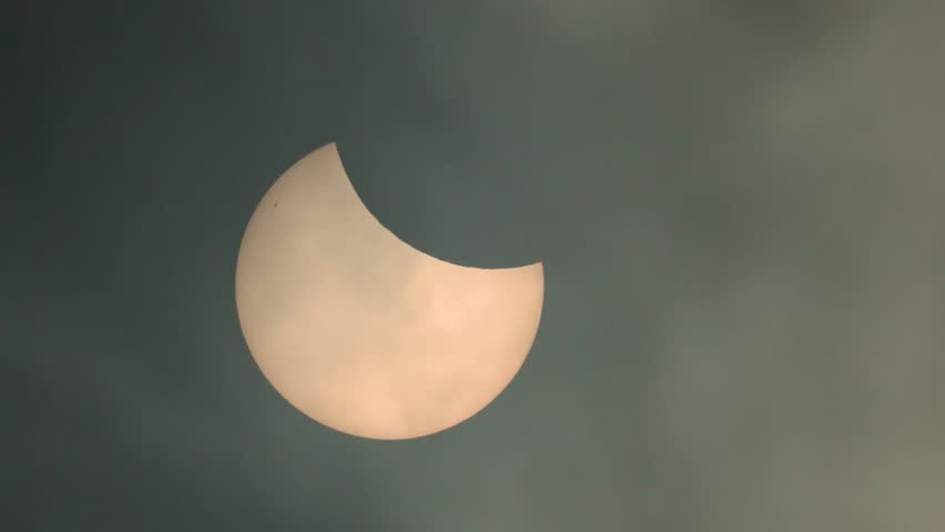 Gothenburg, Sweden - March 29 2025: Partial solar eclipse in hazy green sky