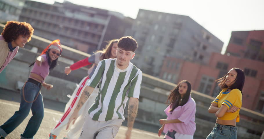 Dance crew, flip and hip hop with man in city for creative, fitness and choreography performance. Artist, celebration and gen z with friends in road for energy, inspiration and streetwear style