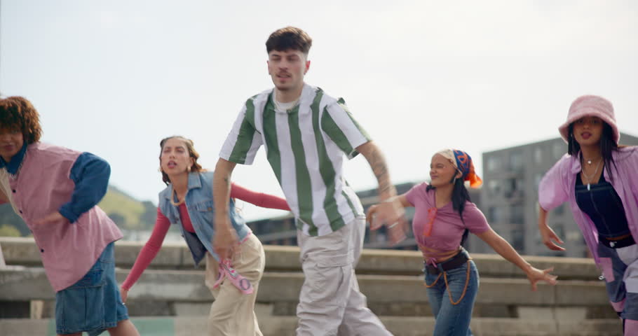 Happy, outdoor and dancing with people in city for hip hop, choreography and performance together. Creative crew, artist and friends with exercise in group for flash mob, energy and celebration
