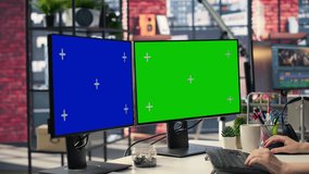 Businesswoman in a modern workplace types on a keyboard next to chroma key, using a creative agency office setup for digital media work. High tech workstation perfect for tasks. Camera A. - Powered by Shutterstock - Get 15% off with code: PIKWIZARD15