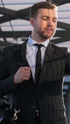 A Businessman Checking the Time at His Modern Workplace in a Corporate Environment Today