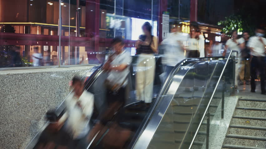 Many chinese people go down escalator in subway, underground pedestrian crossing time lapse. Lazy busy crowd use commuter china metro station timelapse. Lot group walk city street rush hour, hurry up.