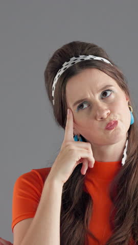 Woman, retro and thinking face with aha in studio for lightbulb moment, insight and surprised by solution. Vintage fashion, girl and thoughtful on gray background with problem solving, eureka and wow