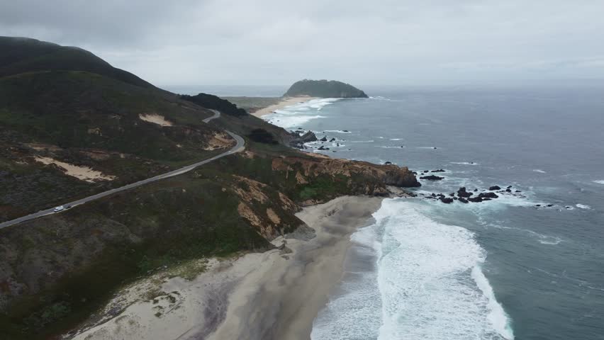 Road Trip, Travel, Adventure (Explore And Discover) The Scenic Big Sur Coast Of California (Highway 1). Aerial Over Beautiful Sea Waves Crashing Over The Sandy Beach Shorelines.