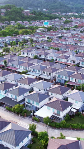 New development real estate. Aerial view of residential houses and driveways neighborhood during a fall sunset or sunrise time. Tightly packed homes. Top view over private houses in phuket thailand