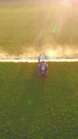 Modern agricultural machinery for watering huge fields, aerial view of irrigation plants. Vertical video above beautiful farmland in ecological area, agribusiness, farmer processing soybean filed