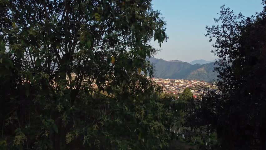 Featuring of cityscape with rugged hills at background in Mexico. Aerial view.