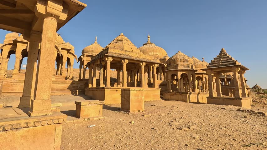 Bada Bagh in Jaisalmer, Rajasthan, is a beautiful site on a sunny day. Surrounded by desert bushes and a clear blue sky, its stunning architecture stands out, showcasing the rich heritage of India