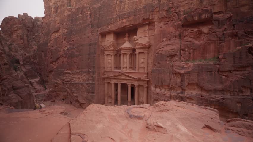 side dolly shot from above of treasury in city of petra in jordan