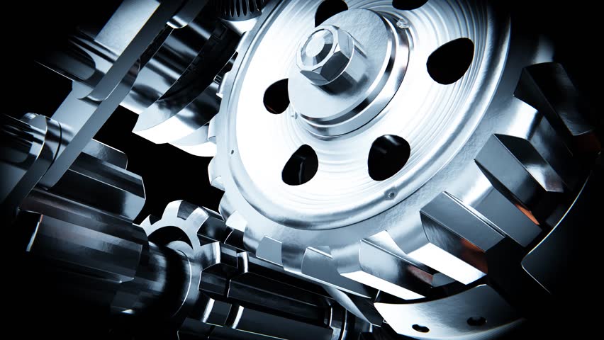 Metallic pistons and gears are rotating inside a complex engine