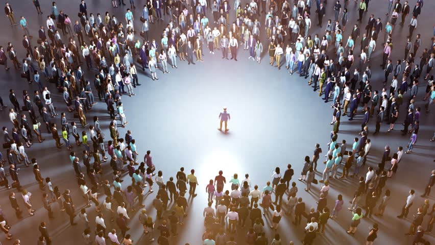 Businessman standing in a circle of people illuminated from above, creating a powerful visual metaphor for leadership