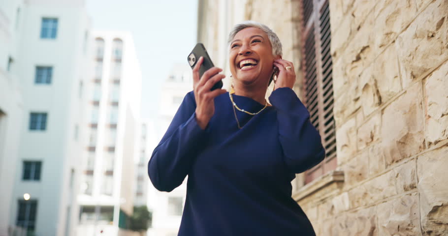 Excited, woman and dancing with earphones in city for listening to music, travel fun and good news. Mature person, rhythm and moving with energy for playlist, morning commute and career celebration