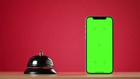 person guest hand ringing service restaurant or hotel bell hold by waiter, phone with chroma key green screen for application - Powered by Shutterstock - Get 15% off with code: PIKWIZARD15