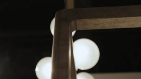 Close-up a wooden frame of four-poster bed and unique spherical bulbs for any space on the background. - Powered by Shutterstock - Get 15% off with code: PIKWIZARD15