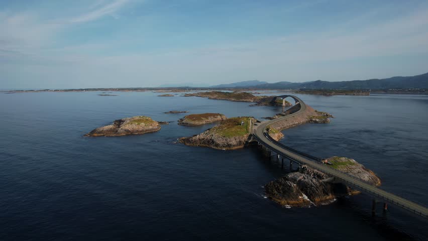 Aerial view of Norway’s Atlantic Ocean Road winding through islands, fjord sea and dramatic coastal scenery.