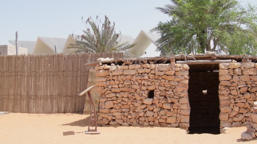 Emirates heritage village display of traditional stone house in Abu dhabi, UAE. Panning view