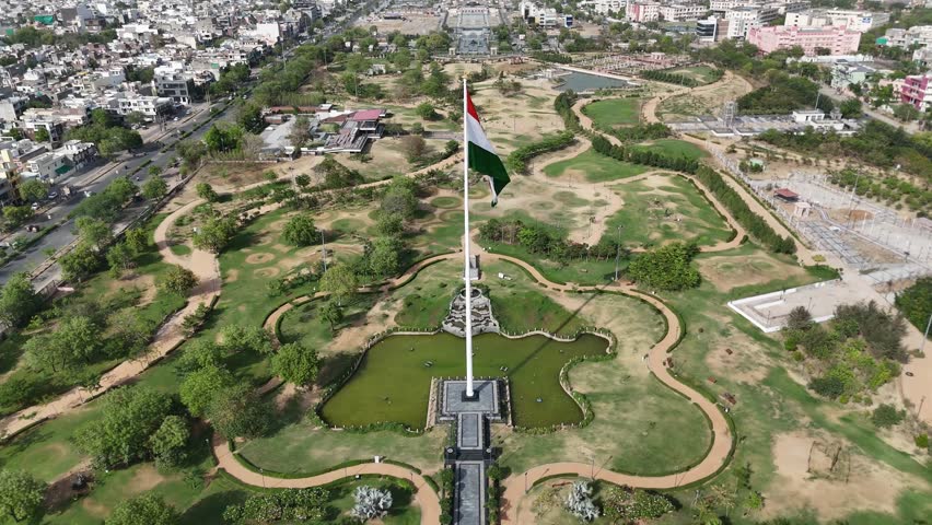 Top-down shot of Indian Flag waving near highway in Jaipur