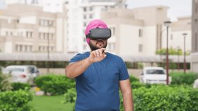 Sikh Indian Man Interacting with VR Interface, Virtual Reality Interface - Powered by Shutterstock - Get 15% off with code: PIKWIZARD15