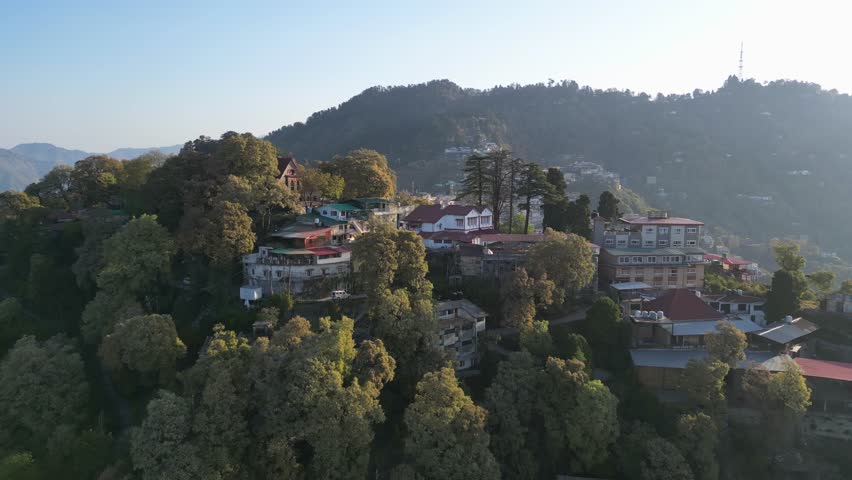 colorful buldings on hills in mussoorie drone view in india