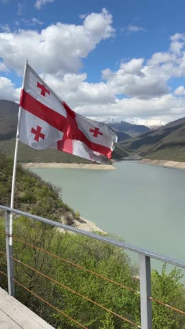 Georgian flag at Zhinvali water reservoir. Vertical footage