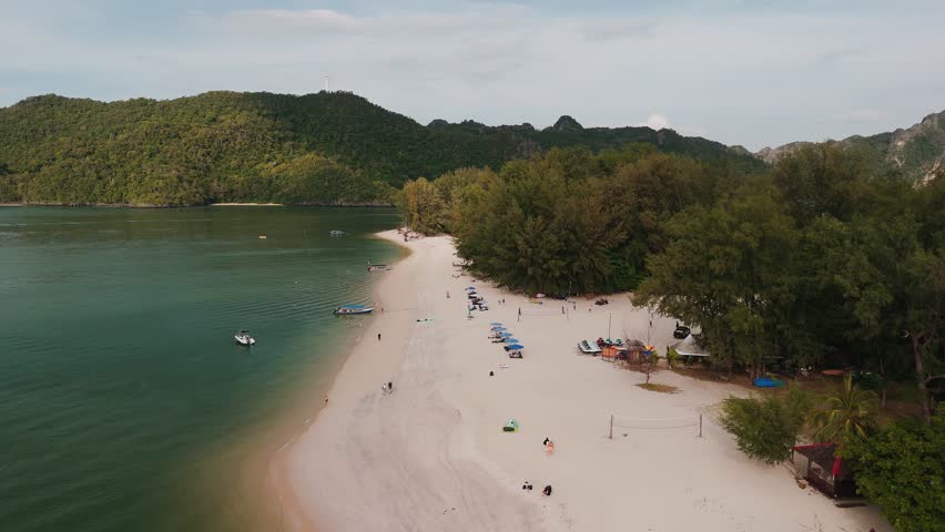 Aerial view of Langkawi coastline, tanjung rhu beach, showcasing white sand, turquoise waters, and lush tropical vegetation