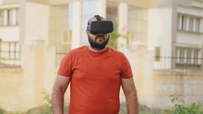 Bald indian Man Removing VR Headset and Smiling at Camera - Powered by Shutterstock - Get 15% off with code: PIKWIZARD15