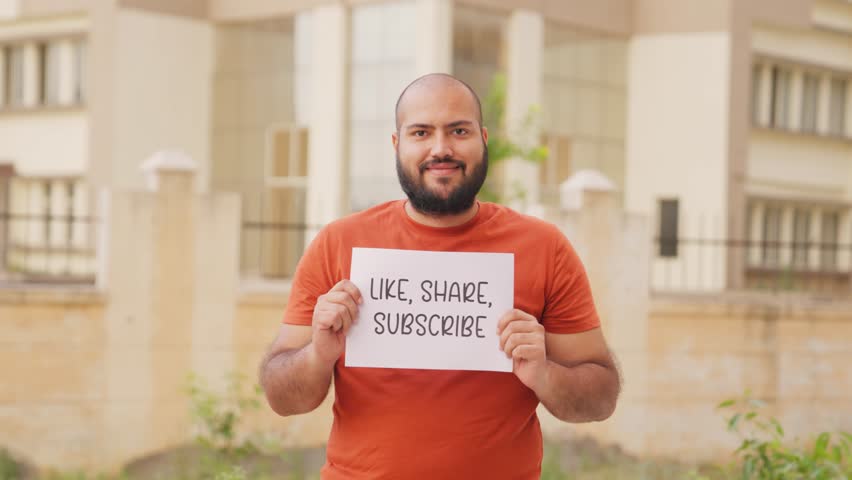 Bald indian Man Holding Like, Share, Subscribe Poster