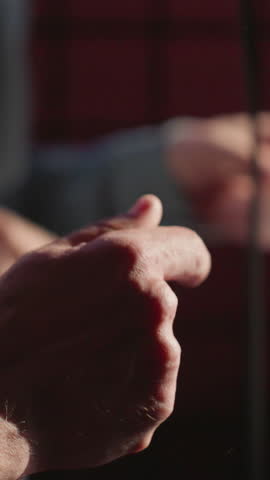 Close-up of hands snapping fingers rhythmically, with a slightly blurred background. emphasizing the energy and movement involved in the gesture