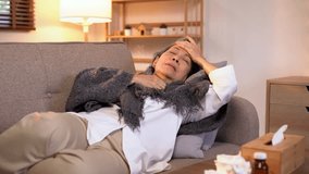 Video 4K Resolution of Senior elderly patient sneezing coughing and pain, flu or sickness with cold or illness in living room - Powered by Shutterstock - Get 15% off with code: PIKWIZARD15