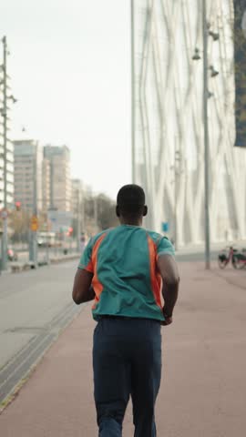 African American man running in the city training sports in the morning
