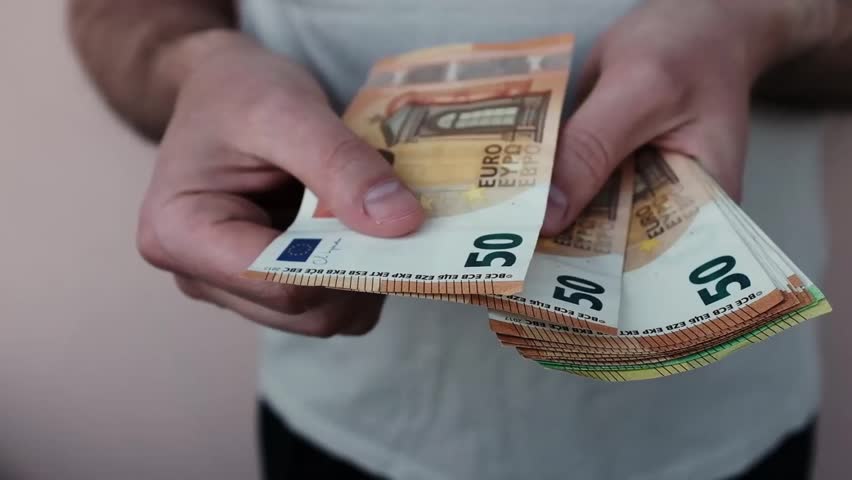 Closeup of man's hands counting Euro cash banknotes. Caucasian man calculates his income, salary, profit. Making money, success, wealth concept. Horizontal video.