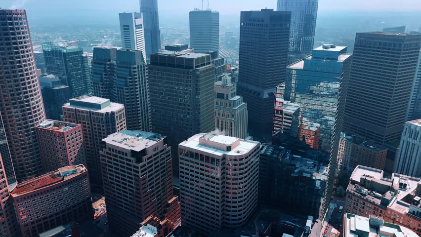 Group of high-rise multi-storied buildings and skyscrapers. Footage over downtown of Boston, Massachusetts, USA.
