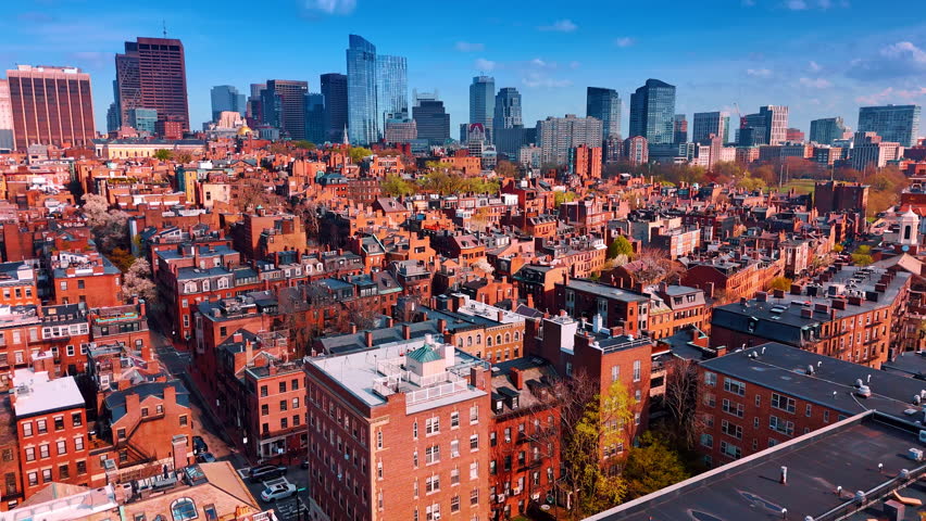 Contrasting old-fashioned brick architecture and concrete-glass skyscrapers. Diversity of buildings in the cityscape of Boston, Massachusetts, USA. Aerial view.