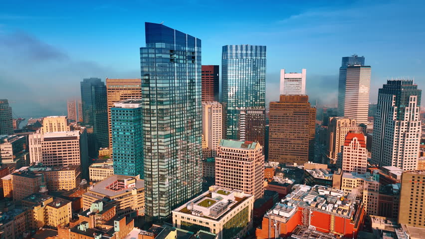 Air pollution in lively modern metropolis. Smoke spreads above Boston, Massachusetts, USA. Aerial view.