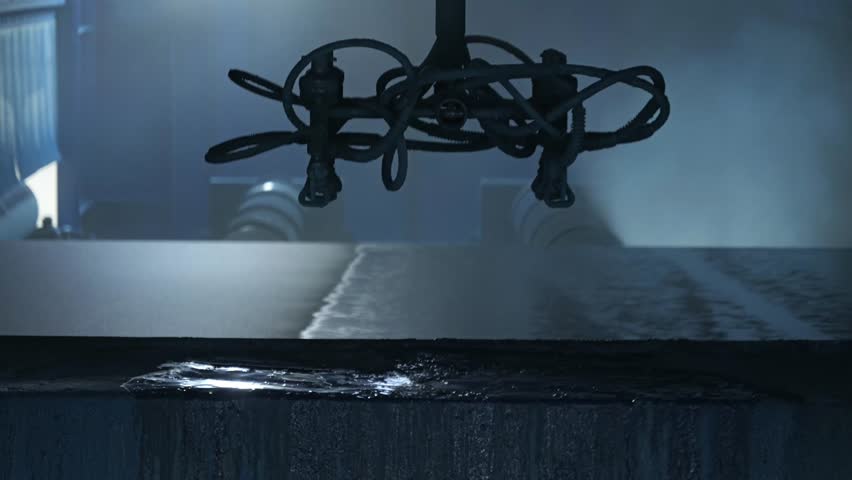 A spray painting system is applying coating to a steel plate, symbolizing rust prevention pretreatment in shipyards and the steel manufacturing concept in iron and steel plants.