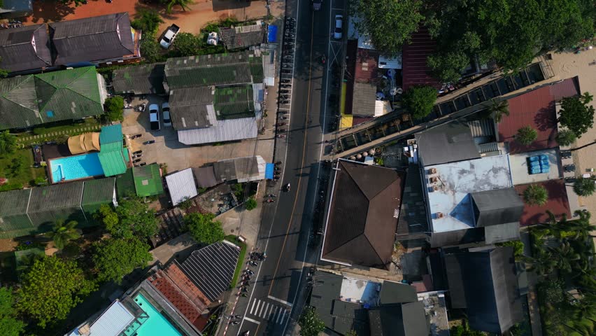 25.1.25 koh chang tha, cars on village road. Dramatic aerial view flight drone