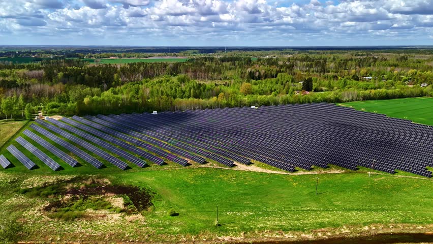Renewable energy solar photovoltaic panel green electricity production timelapse moving cloud shadow