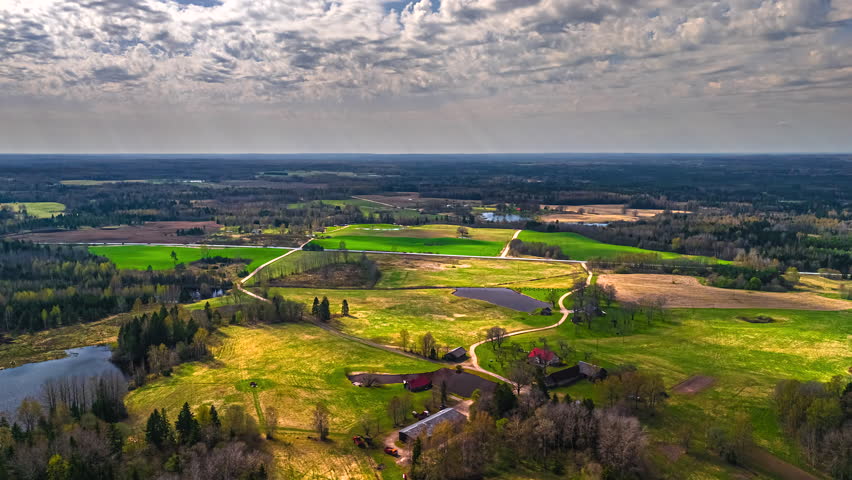 Moving clouds shadow over rural farmland land countryside farm timelapse