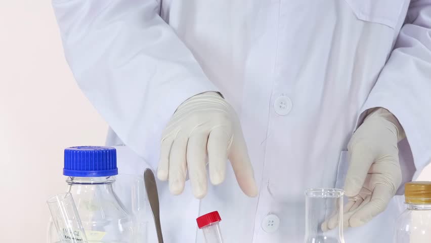 Scientist stirring yellow substance in laboratory setting - Powered by Shutterstock - Get 15% off with code: PIKWIZARD15