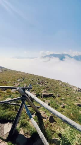 Vertical Panoramic View of the Rocky Mountains from a Viewing Deck, Misty Clouds Over Colorado National Park, Scenic Landscape in Portrait Mode – Real-Time Mobile View