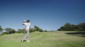 Golfer performing swing on sunny golf course - Powered by Shutterstock - Get 15% off with code: PIKWIZARD15