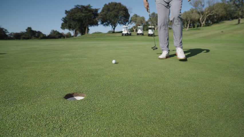 Golfer putting ball on green in six sequential shots