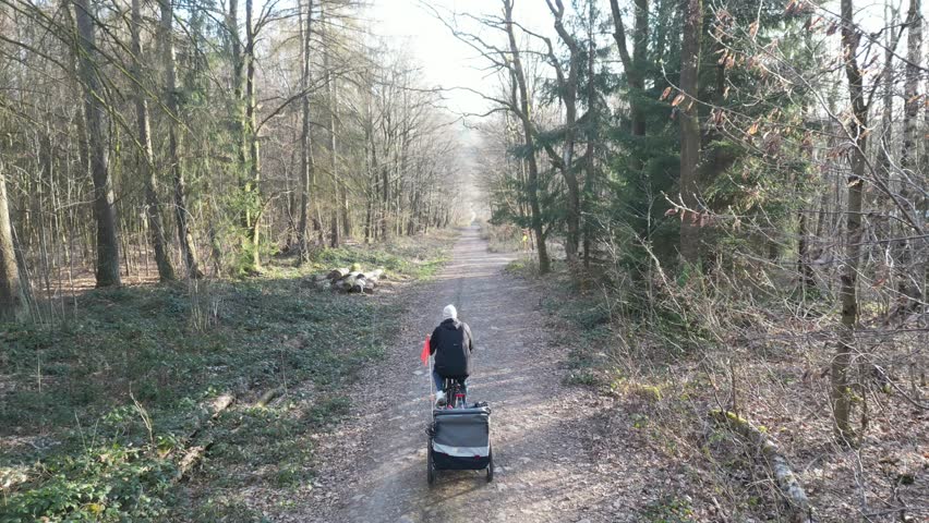 Father Riding Bike with Child Trailer in Nature – Active Family Lifestyle Outdoors